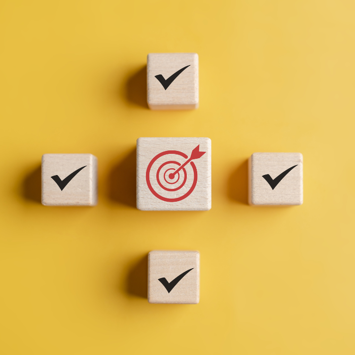 Wooden blocks with ticks and a target in the middle