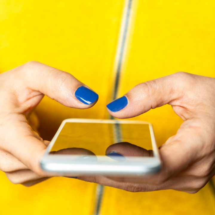 Close up of hands using mobile phone